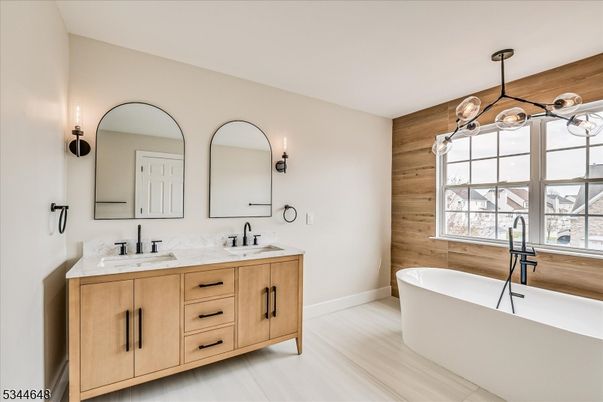 Bathroom, Chandelier, Dual Sink Vanities, Free Standing Baths, Interior, Pendant Lights, Wood Texture Flooring, Wooden Walls