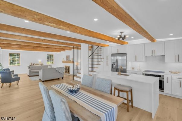 Dining room, Interior, Kitchen, Living room, Pendant Lights, Recessed Lighting, Stainless Steel Appliances, Wooden Beams, Wood Texture Flooring