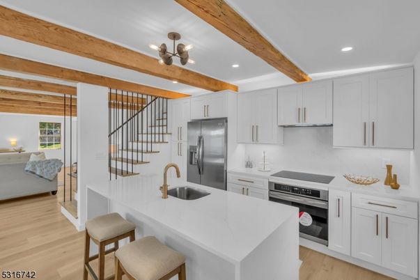 Chandelier, Interior, Kitchen, Living room, Pendant Lights, Recessed Lighting, Stainless Steel Appliances, Wooden Beams, Wood Texture Flooring