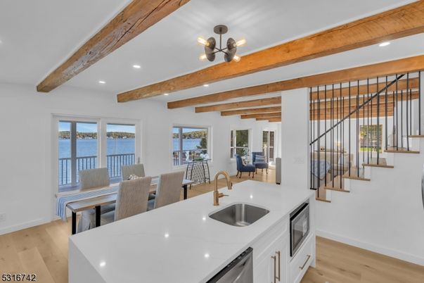 Dining room, Interior, Kitchen, Pendant Lights, Recessed Lighting, Stainless Steel Appliances, Water, Wooden Beams, Wood Texture Flooring