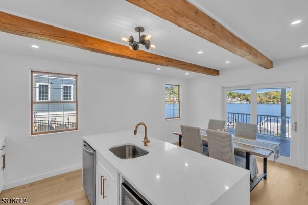 Chandelier, Dining room, Interior, Kitchen, Recessed Lighting, Water, Wooden Beams, Wood Texture Flooring