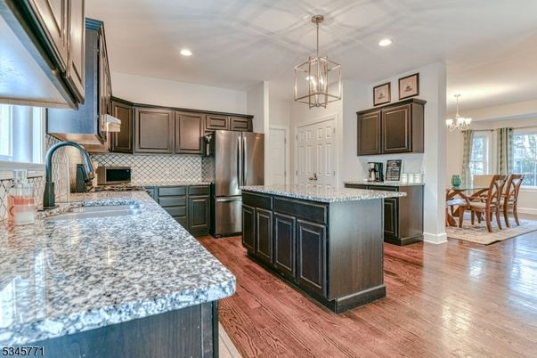 Chandelier, Dining room, Interior, Kitchen, Pendant Lights, Recessed Lighting, Stainless Steel Appliances, Wood Texture Flooring