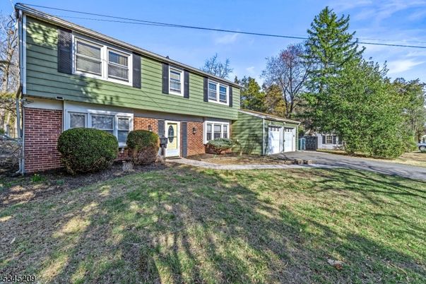Attached, Backyard, Exterior, Facade, Brick Facade, Raised Ranch