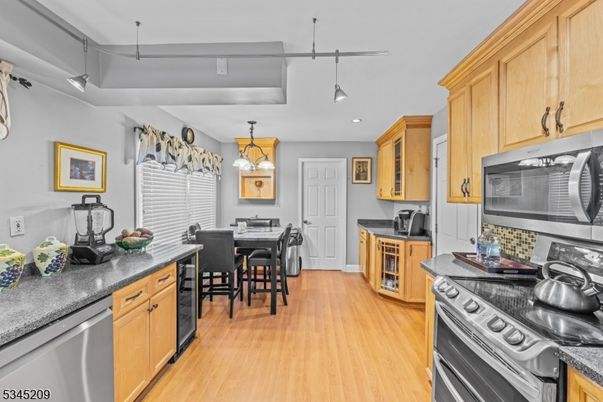 Dining room, Interior, Kitchen, Pendant Lights, Recessed Lighting, Stainless Steel Appliances, Wood Texture Flooring