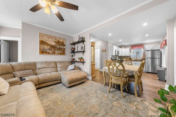 Dining room, Interior, Kitchen, Living room, Recessed Lighting, Stainless Steel Appliances, Wood Texture Flooring