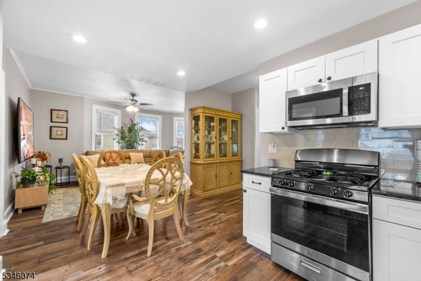 Dining room, Interior, Kitchen, Recessed Lighting, Stainless Steel Appliances, Wood Texture Flooring