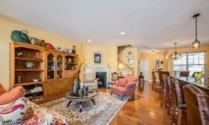 Chandelier, Dining room, Fireplace, Interior, Living room, Pendant Lights, Recessed Lighting, Wood Texture Flooring