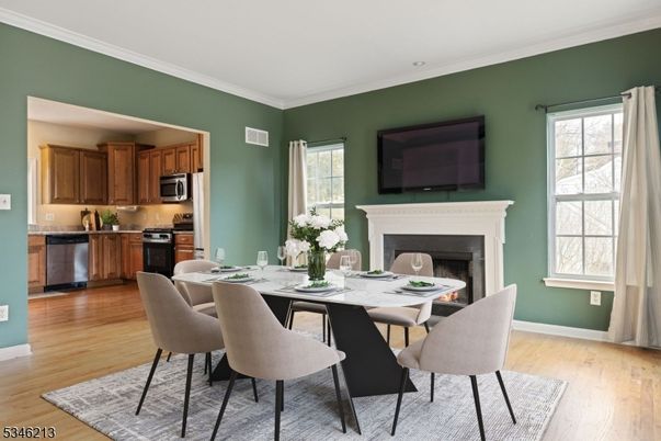 Dining room, Fireplace, Interior, Kitchen, Stainless Steel Appliances, Wood Texture Flooring