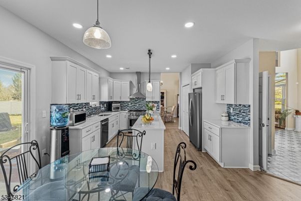 Dining room, Interior, Kitchen, Pendant Lights, Recessed Lighting, Stainless Steel Appliances, Wood Texture Flooring