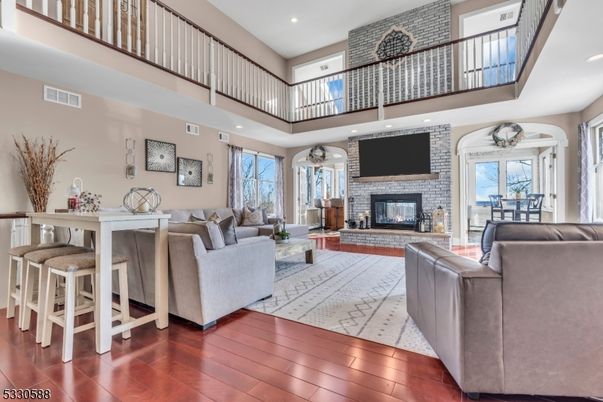 Fireplace, Interior, Living room, Recessed Lighting, Stone Walls, Wood Texture Flooring