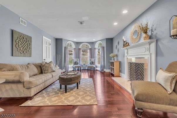 Dining room, Fireplace, Interior, Living room, Recessed Lighting, Wood Texture Flooring
