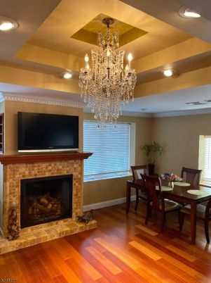 Chandelier, Dining room, Fireplace, Interior, Recessed Lighting, Wood Texture Flooring