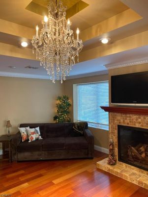 Chandelier, Fireplace, Interior, Recessed Lighting, Wood Texture Flooring