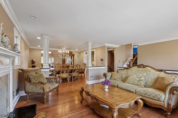 Chandelier, Dining room, Fireplace, Interior, Living room, Recessed Lighting, Wood Texture Flooring