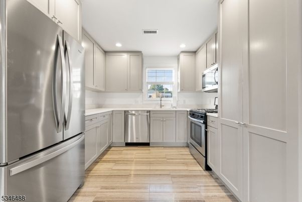 Interior, Kitchen, Recessed Lighting, Stainless Steel Appliances, Wood Texture Flooring