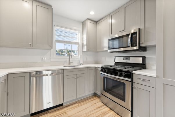 Interior, Kitchen, Recessed Lighting, Stainless Steel Appliances, Wood Texture Flooring