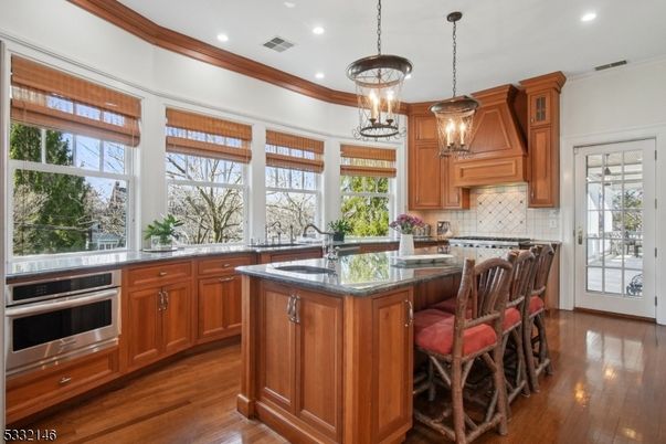 Chandelier, Interior, Kitchen, Pendant Lights, Recessed Lighting, Stainless Steel Appliances, Wood Texture Flooring
