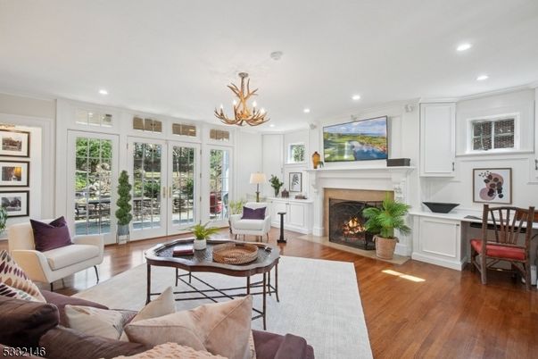 Chandelier, Fireplace, Home Office, Interior, Living room, Recessed Lighting, Wood Texture Flooring