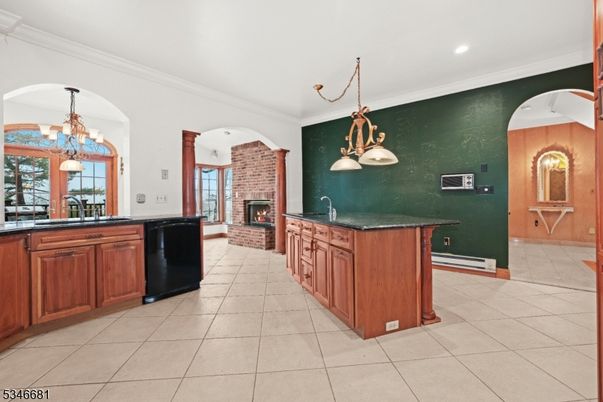 Chandelier, Fireplace, Interior, Kitchen, Pendant Lights, Recessed Lighting, Stone Walls