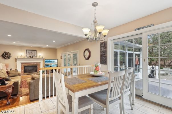 Dining room, Fireplace, Interior, Living room, Pendant Lights, Recessed Lighting, Wood Texture Flooring