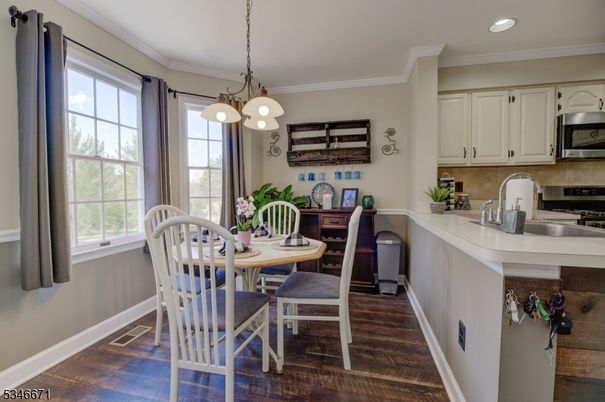 Dining room, Interior, Kitchen, Pendant Lights, Recessed Lighting, Stainless Steel Appliances, Wood Texture Flooring