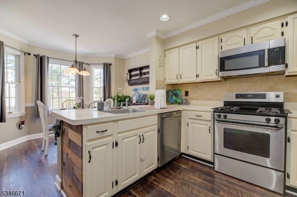Dining room, Interior, Kitchen, Pendant Lights, Recessed Lighting, Stainless Steel Appliances, Wood Texture Flooring