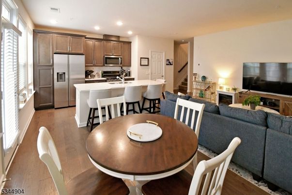 Dining room, Interior, Kitchen, Living room, Recessed Lighting, Stainless Steel Appliances, Wood Texture Flooring