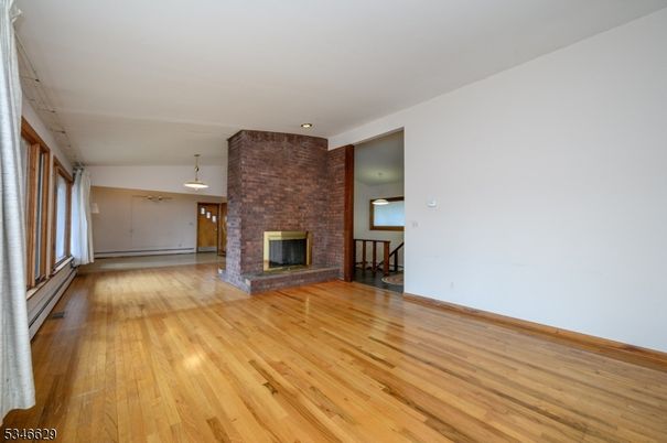 Empty room, Fireplace, Interior, Pendant Lights, Stone Walls, Wood Texture Flooring