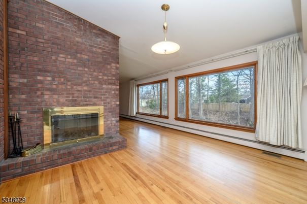 Empty room, Fireplace, Interior, Pendant Lights, Stone Walls, Wood Texture Flooring