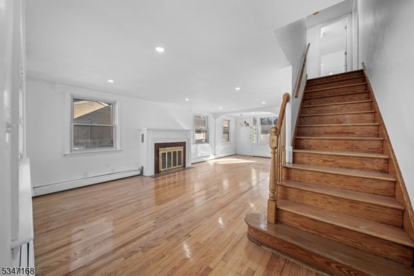 Empty room, Fireplace, Interior, Recessed Lighting, Wood Texture Flooring