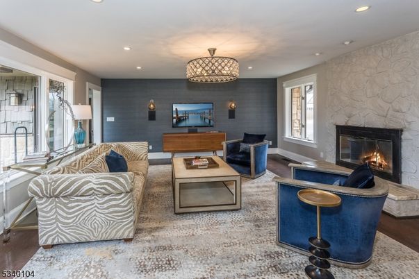 Fireplace, Interior, Living room, Recessed Lighting, Stone Walls, Wood Texture Flooring