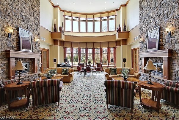 Dining room, Fireplace, Interior, Living room, Piano, Recessed Lighting, Stone Walls