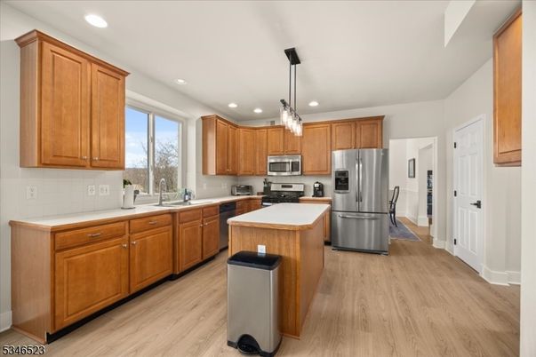 Chandelier, Interior, Kitchen, Pendant Lights, Recessed Lighting, Stainless Steel Appliances, Wood Texture Flooring