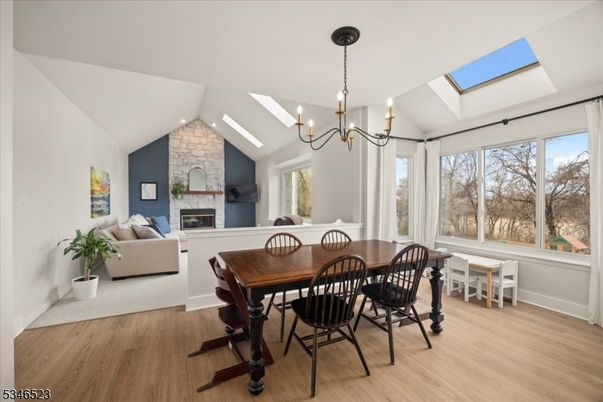 Chandelier, Dining room, Fireplace, Interior, Living room, Stone Walls, Wood Texture Flooring