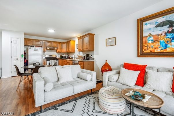 Dining room, Interior, Kitchen, Living room, Recessed Lighting, Stainless Steel Appliances, Wood Texture Flooring