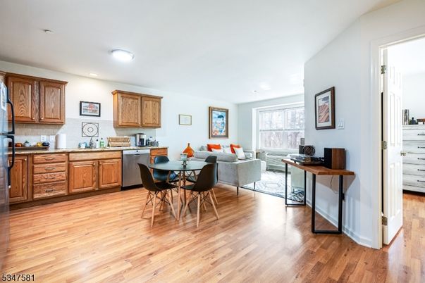 Dining room, Interior, Kitchen, Living room, Recessed Lighting, Stainless Steel Appliances, Wood Texture Flooring