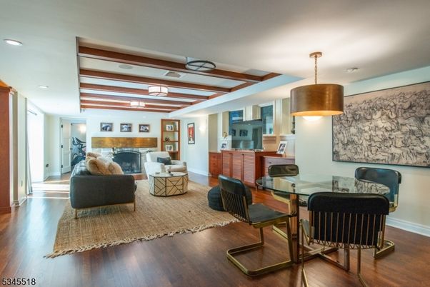 Dining room, Fireplace, Interior, Living room, Pendant Lights, Recessed Lighting, Wooden Beams, Wood Texture Flooring