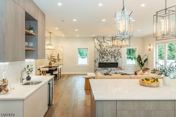 Chandelier, Dining room, Fireplace, Interior, Kitchen, Living room, Pendant Lights, Recessed Lighting, Wood Texture Flooring