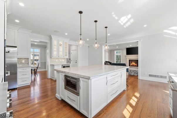 Fireplace, Interior, Kitchen, Pendant Lights, Recessed Lighting, Stainless Steel Appliances, Wood Texture Flooring