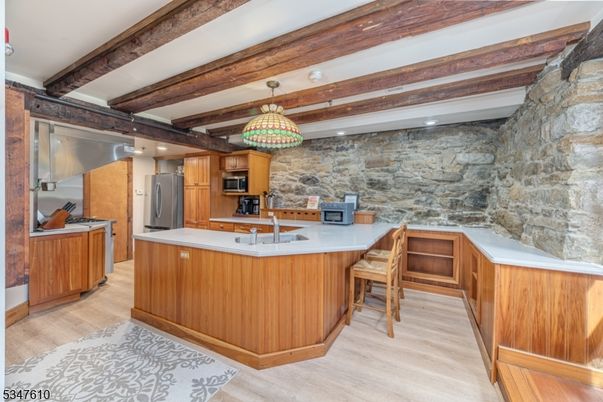 Interior, Kitchen, Pendant Lights, Recessed Lighting, Stainless Steel Appliances, Stone Walls, Wooden Beams, Wood Texture Flooring