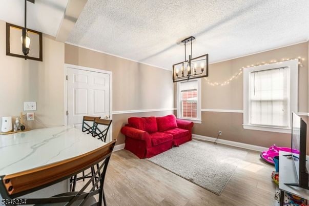 Dining room, Fireplace, Interior, Pendant Lights, Wood Texture Flooring