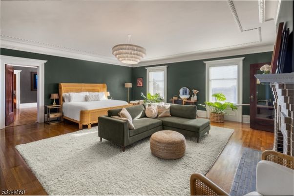 Bedroom, Chandelier, Fireplace, Interior, Wood Texture Flooring