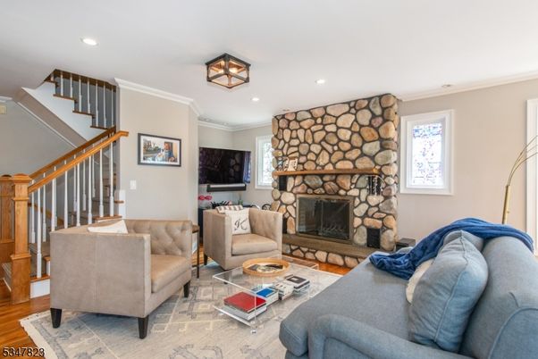 Fireplace, Interior, Living room, Recessed Lighting, Stone Walls, Wood Texture Flooring