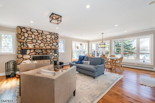 Dining room, Fireplace, Interior, Living room, Pendant Lights, Recessed Lighting, Stone Walls, Wood Texture Flooring