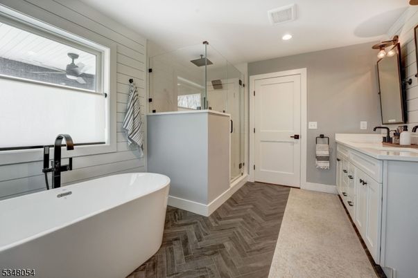 Bathroom, Dual Sink Vanities, Free Standing Baths, Glass Shower, Interior, Recessed Lighting, Wood Texture Flooring