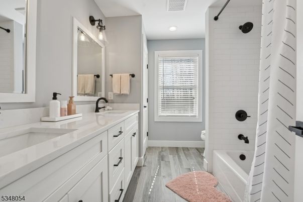 Bathroom, Dual Sink Vanities, Interior, Recessed Lighting, Wood Texture Flooring