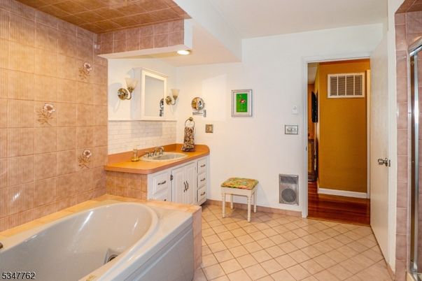 Bathroom, Dual Sink Vanities, Interior, Recessed Lighting, Wood Texture Flooring