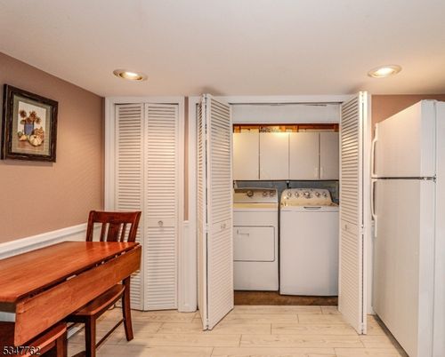 Dining room, Interior, Recessed Lighting, Utility Closets, Washer, Wood Texture Flooring