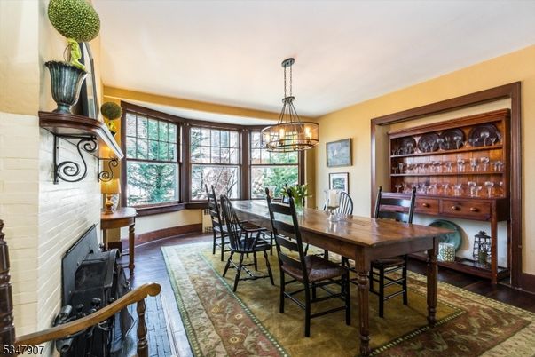 Dining room, Fireplace, Interior, Pendant Lights, Stone Walls, Wood Texture Flooring