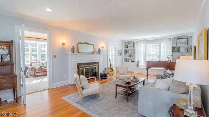 Fireplace, Interior, Living room, Piano, Recessed Lighting, Wood Texture Flooring